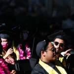 Cal State Los Angeles graduates sit at their commencement ceremony on July 27, 2021, in Los Angeles, Calif. Some recent graduates have found that the job search is taking longer than they expected, per a ZipRecruiter report.