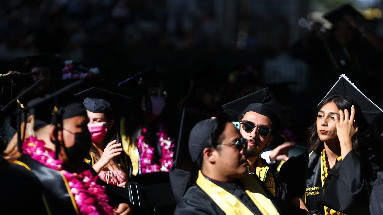 Cal State Los Angeles graduates sit at their commencement ceremony on July 27, 2021, in Los Angeles, Calif. Some recent graduates have found that the job search is taking longer than they expected, per a ZipRecruiter report.