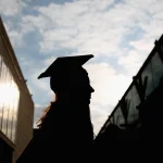 A student arrives for their graduation ceremony at the Royal Festival Hall on Oct. 13, 2015, in London, England. Seventy-five percent of upcoming college graduates said they're worried their job prospects will be affected by the economy, a recent report found.