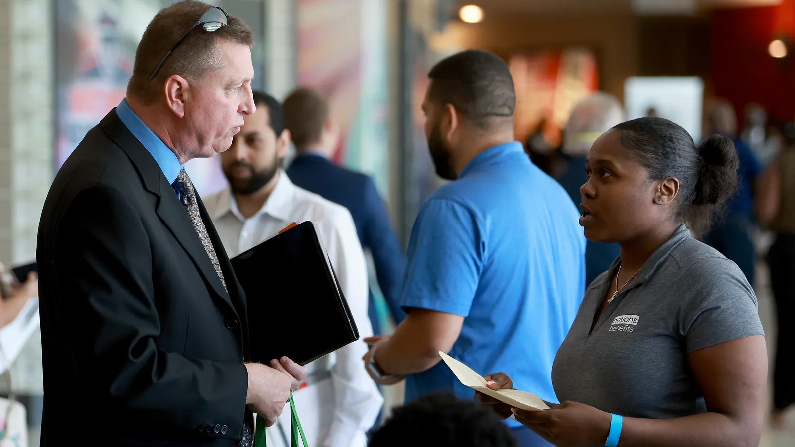 A recruiter speaks with a candidate at the Mega Job Fair held June 23, 2022, in Sunrise, Fla. Organizations tend to hire candidates who they have the strongest “gut feeling about,” the Textio report found.
