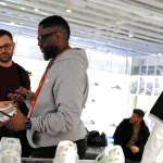 An employee helps a customer at a store on April 3, 2025, in New York City. Employee engagement dipped in 2024 — and managers may be at the heart of the problem.