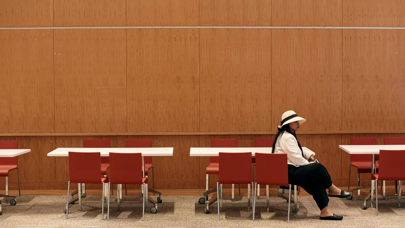 An attendee waits for a job interview during a job fair on June 29, 2024, in New York City, N.Y. In a survey of 1,000 U.S. job seekers, 84% said they prefer to have a person conduct an initial interview to answer simple questions, rather than AI.