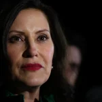Michigan Gov. Gretchen Whitmer listens to reporters during a news conference on Nov. 7, 2022, in East Lansing, Mich. Whitmer recently directed Michigan agencies to reach out to men and inform them about tuition-free opportunities for college and skills training.