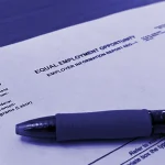 A copy of the U.S. Equal Employment Opportunity Commission's EEO-1 filing form sits on a reporter's desk on Oct. 24, 2024, in Baltimore, Md. EEOC has indicated it will open its filing process for 2024 data on May 20, 2025.