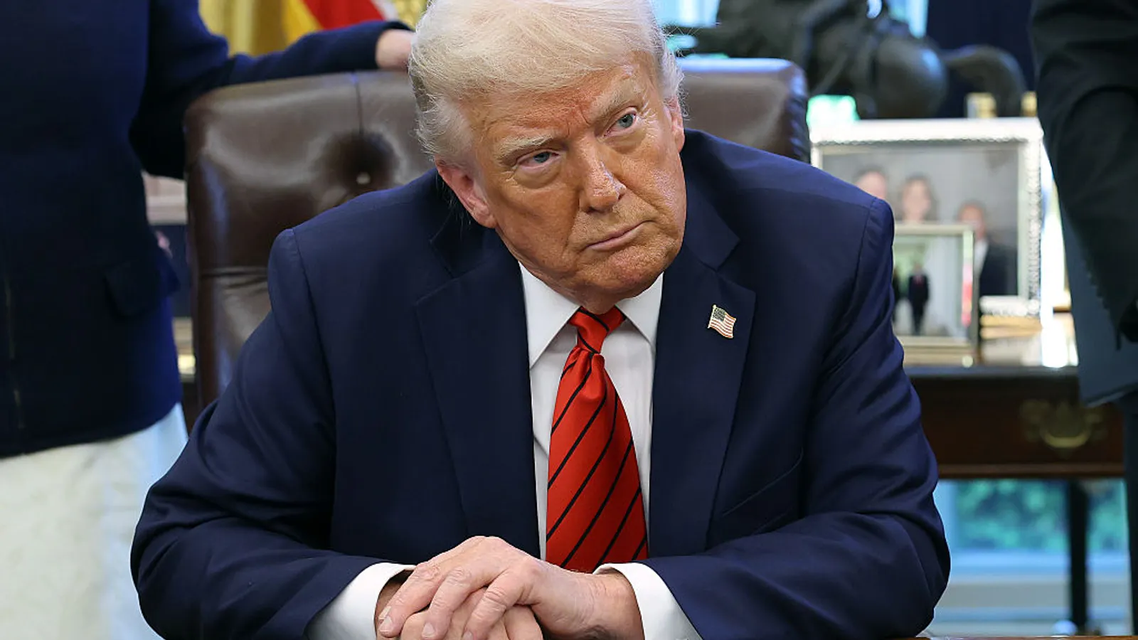 President Donald Trump speaks to reporters in the Oval Office at the White House on April 17, 2025, in Washington, D.C. Trump directed federal agencies to end disparate-impact liability under civil rights laws.