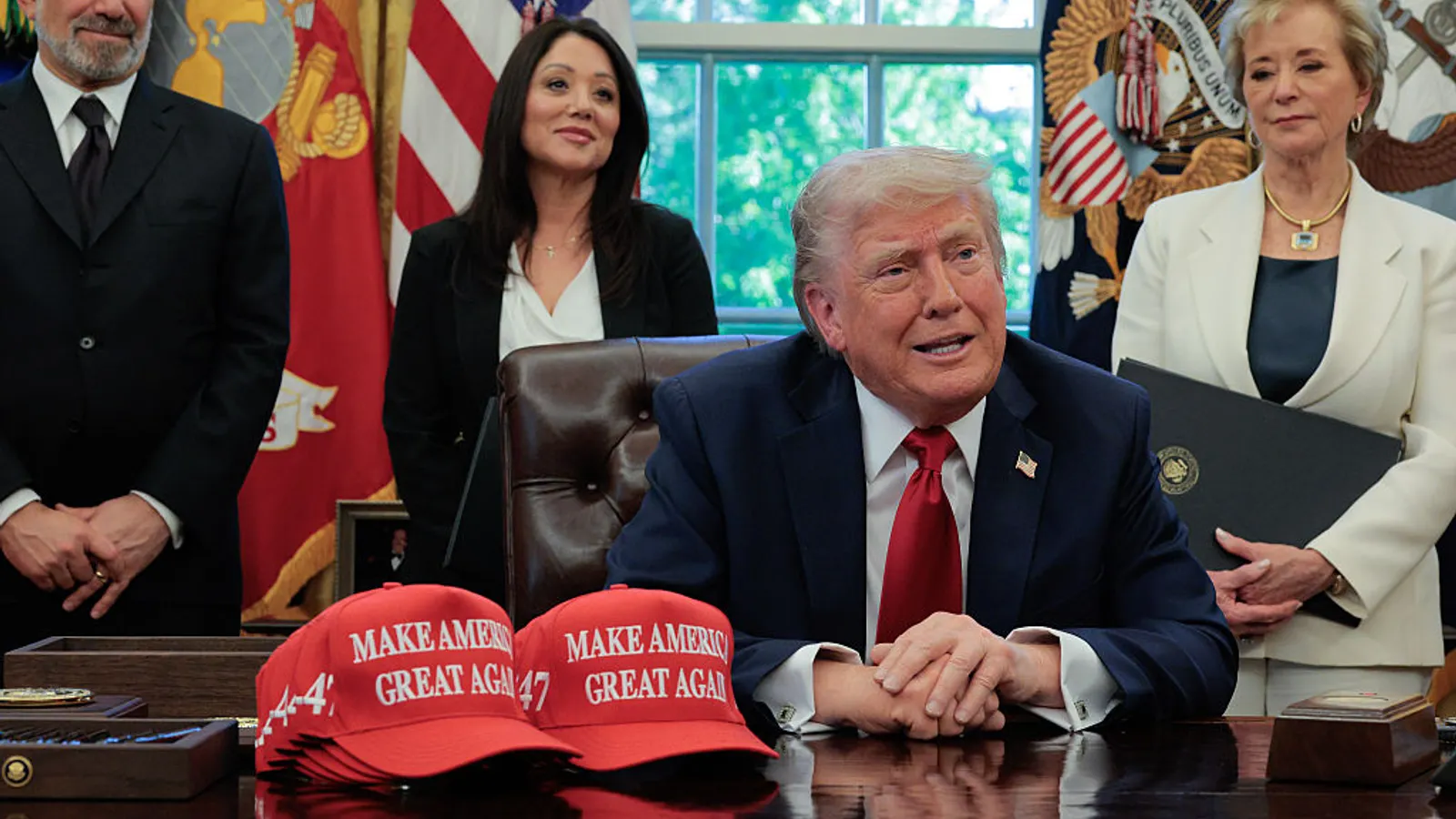 U.S. President Donald Trump speaks to the media as (L-R) Secretary of Commerce Howard Lutnick, Secretary of Labor Lori Chavez-DeRemer and Secretary of Education Linda McMahon look on after signing executive orders in the Oval Office at the White House on April 23, 2025, in Washington, D.C. One of those orders was the apprenticeship order.