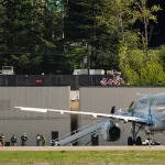 Detainees are transferred to a plane chartered by U.S. Immigration and Customs Enforcement at King County International Airport on April 15, 2025, in Seattle, Wash. President Donald Trump said he may consider allowing some immigrants who self-deport to return to the U.S.