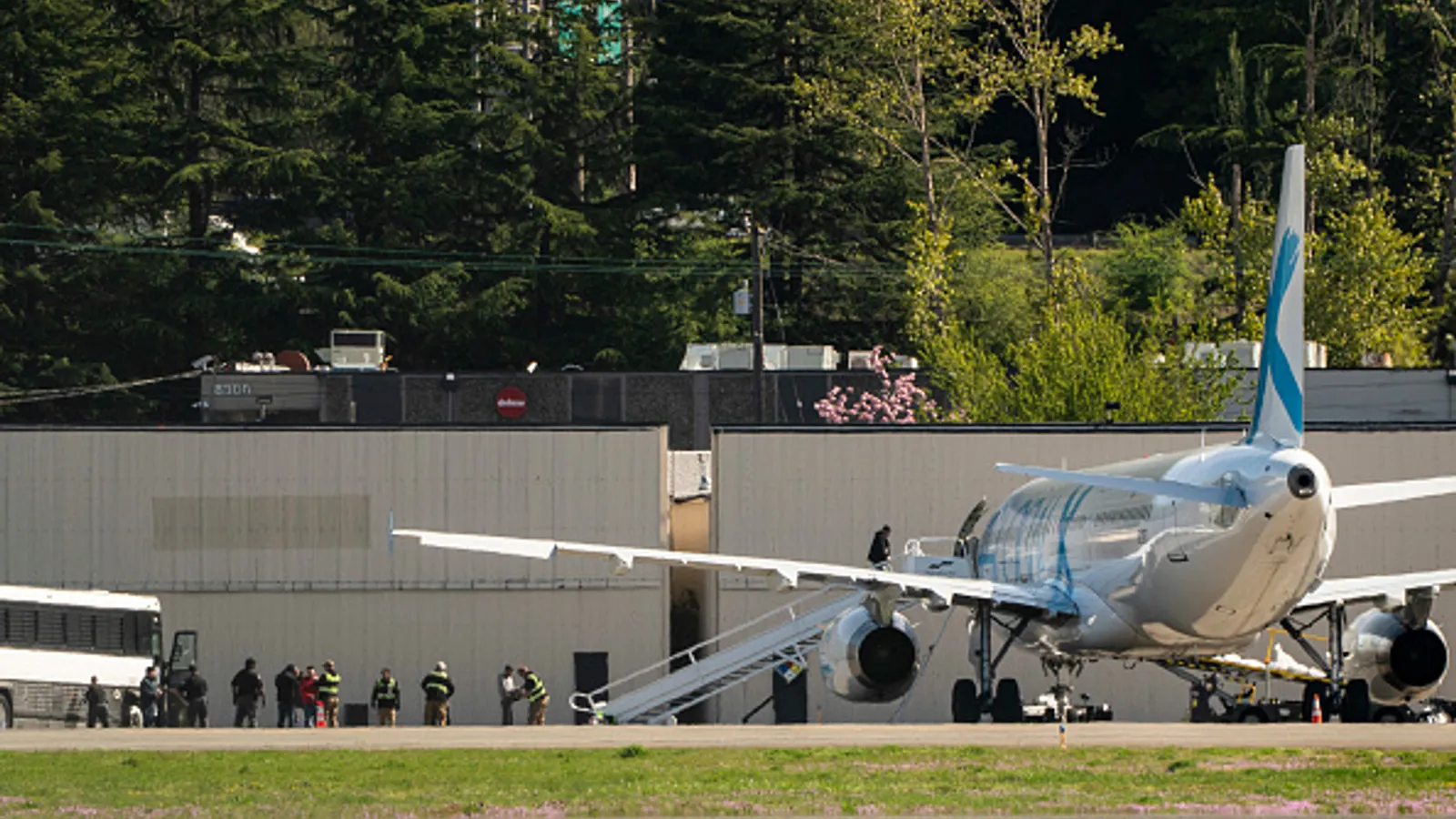 Detainees are transferred to a plane chartered by U.S. Immigration and Customs Enforcement at King County International Airport on April 15, 2025, in Seattle, Wash. President Donald Trump said he may consider allowing some immigrants who self-deport to return to the U.S.