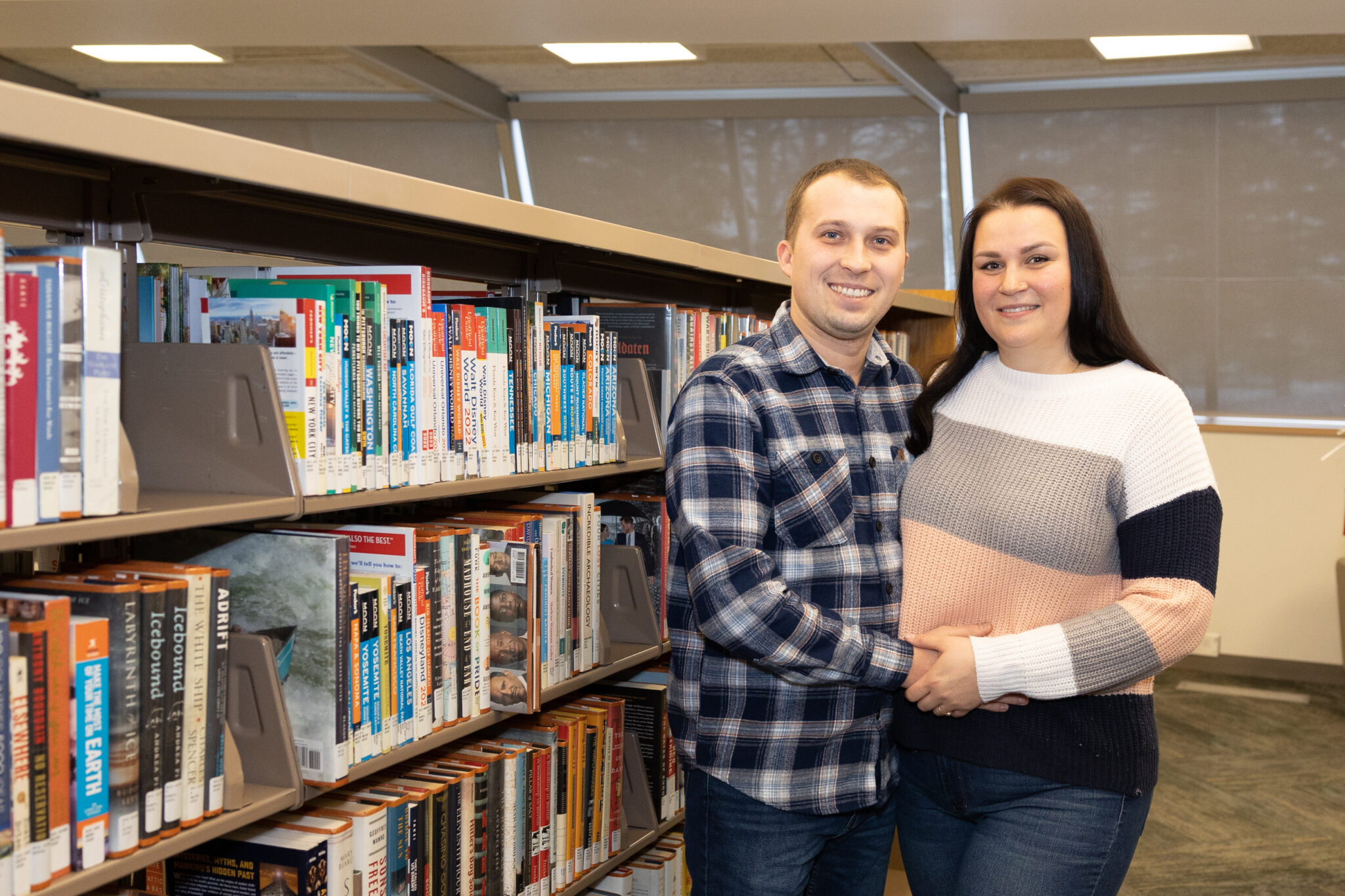 PARMA HEIGHTS, OH — JANUARY 26: Ukrainians Marta and Taras Chaban who fled the violence of the war pose for a portrait at the library where they take English classes twice a week, January 26, 2023, at the Cuyahoga County Public Library – Parma Heights Branch, in Parma Heights, Ohio. (Photo by Graham Stokes for Ohio Capital Journal)