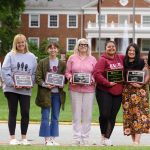 (From left to right) Dee Fuller, Elizabeth Bowen, Gia Pineda, Susan Tripp, Tumi Shadreck, Kelly Harer and Lasse Palomaki pose for a photo with their award plaques following Staff Appreciation Day on May 30, 2025.