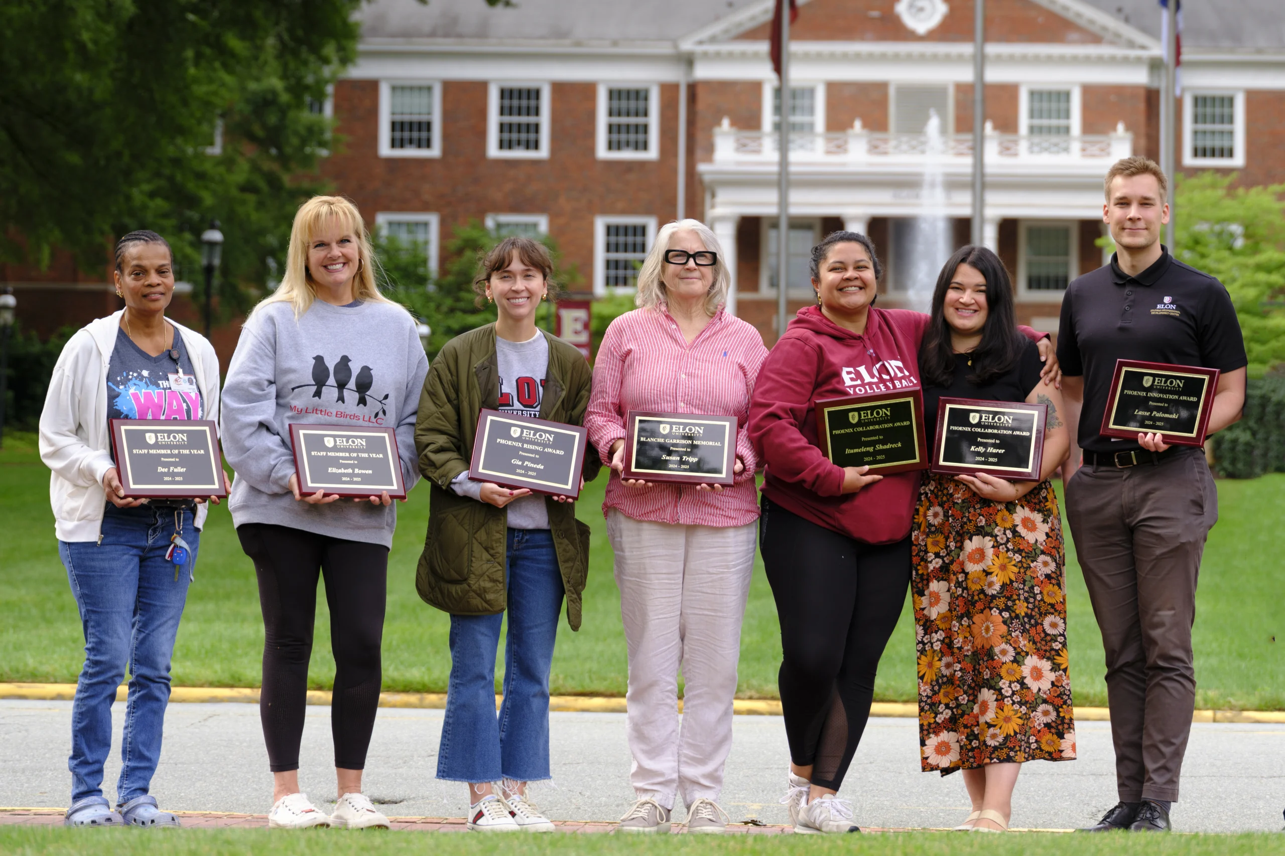 (From left to right) Dee Fuller, Elizabeth Bowen, Gia Pineda, Susan Tripp, Tumi Shadreck, Kelly Harer and Lasse Palomaki pose for a photo with their award plaques following Staff Appreciation Day on May 30, 2025.